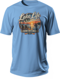 Blue T-shirt with Lake Life lettering above a lakeside sunset scene and the slogan Slow Days, Good Times.